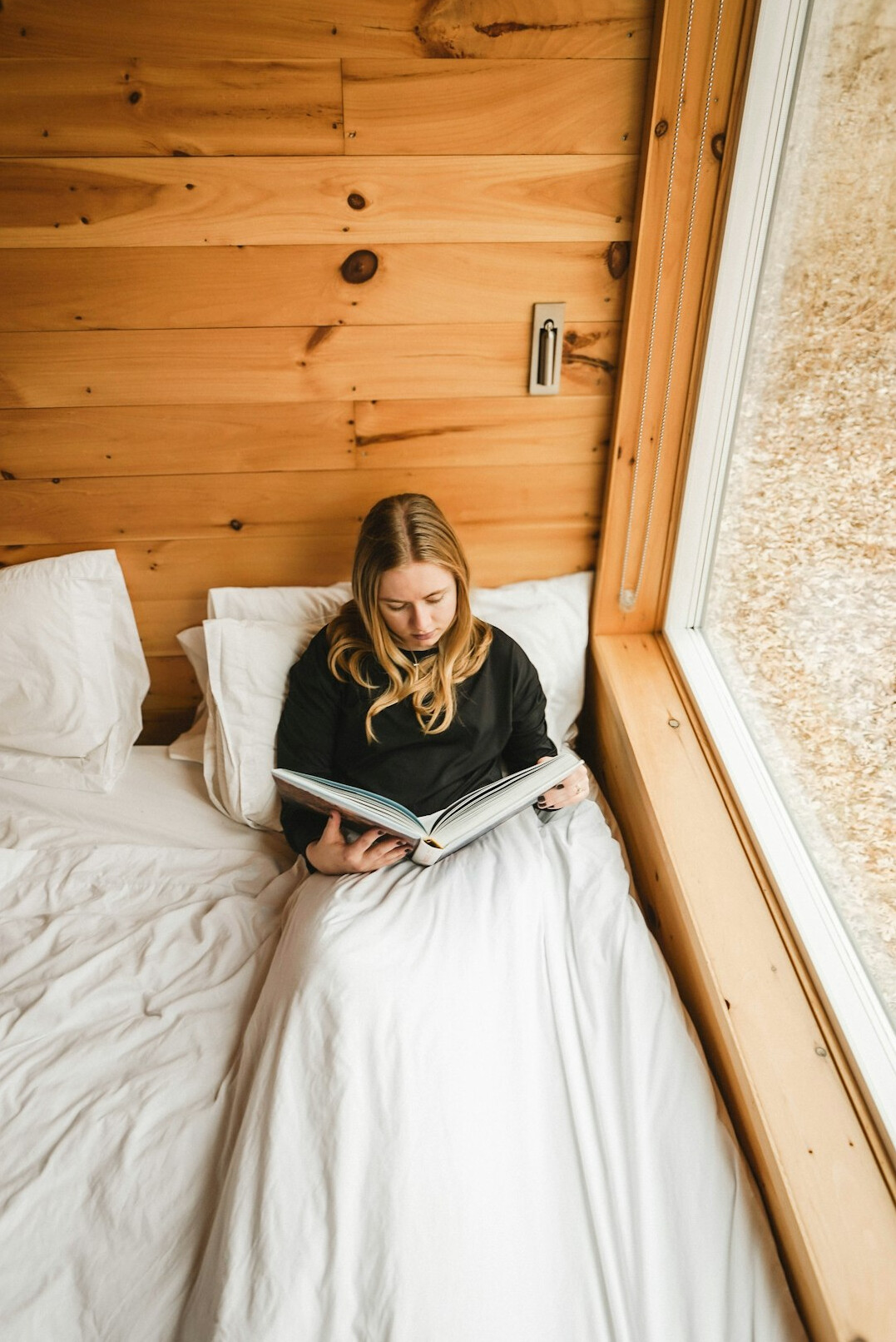 person reading in bed